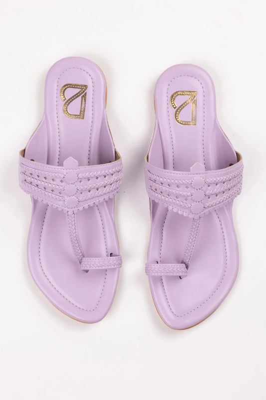 Pair of lavender handcrafted women's jutti sandals with braided straps and toe loops by Label Deepti Bajaj