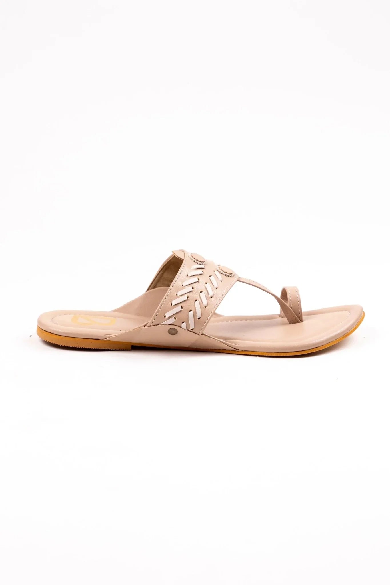 Beige women's handcrafted leather jutti sandal with decorative cutout and stitched details, flat sole