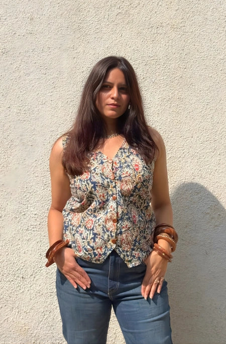 Intricately hand-painted Kalamkari cotton fabric showcasing a vibrant floral motif and traditional Indian storytelling.